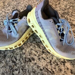 On Running Shoes with Gray and Yellow Accents